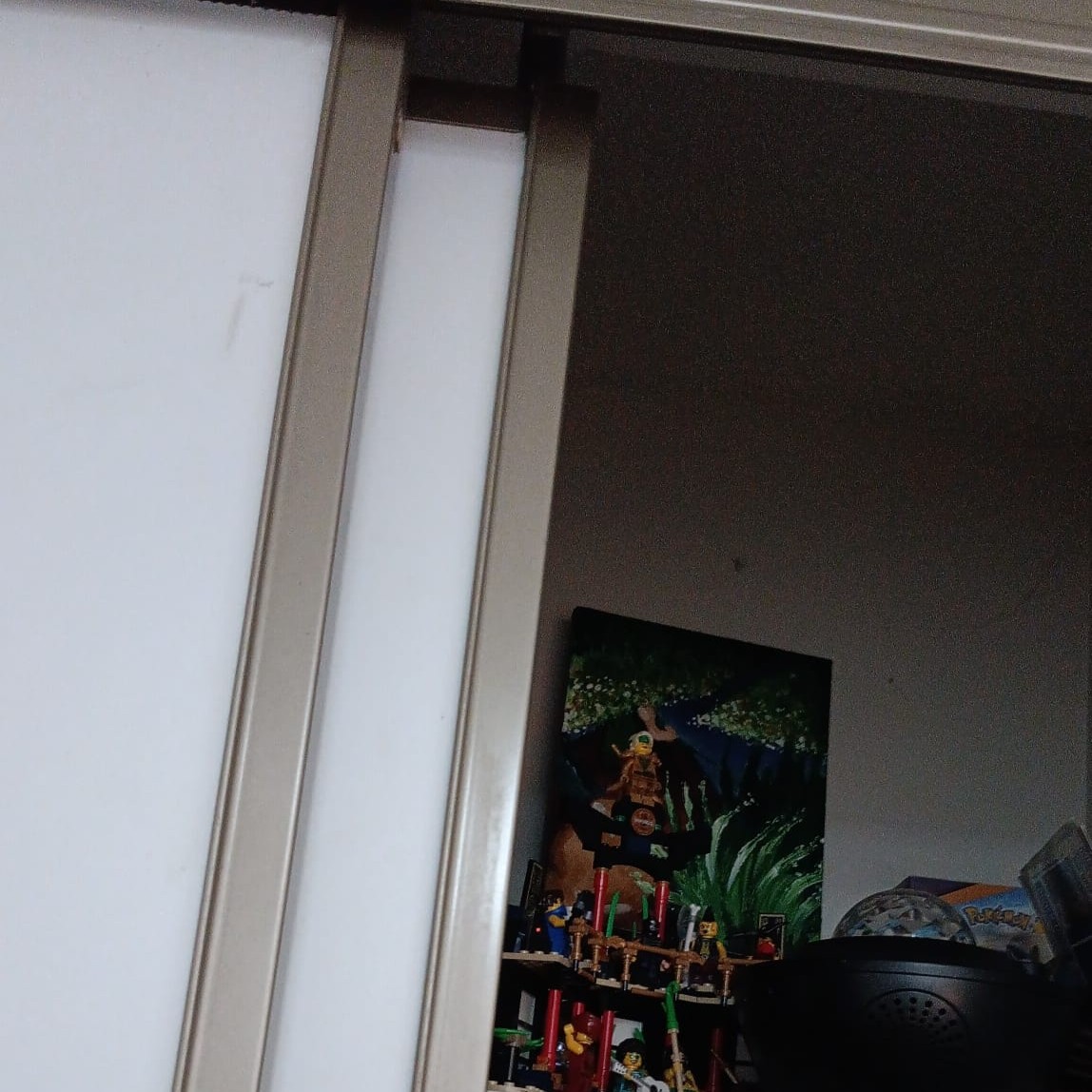 A second view of the sliding closet doors emphasizing horizontal movement.