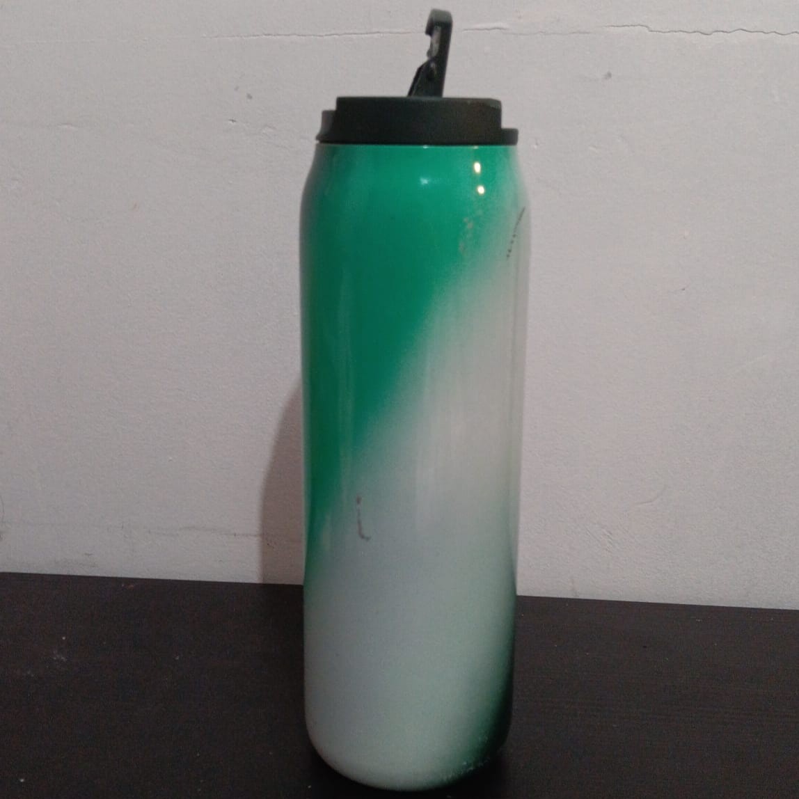 A reusable water bottle with a screw-top lid that suggests rotational movement. An open and shut movement as well for actually opening my water bottle.