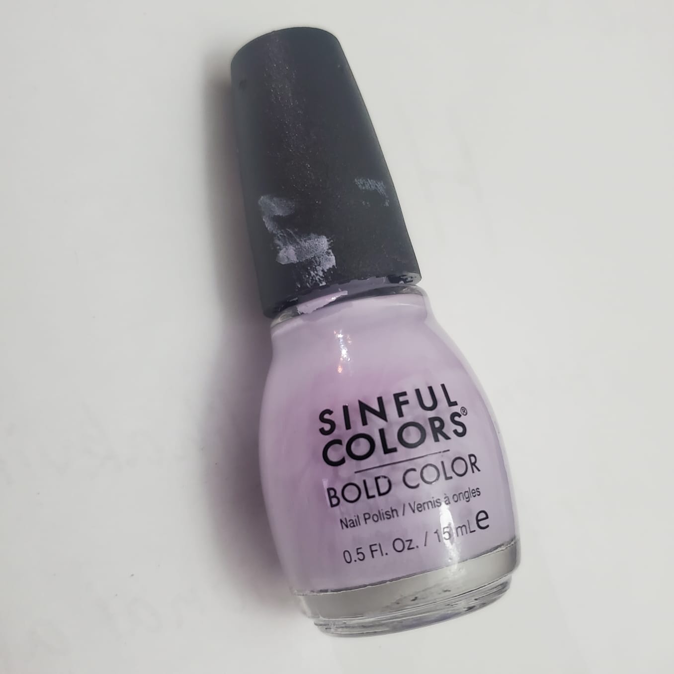 Purple Nail Polish Bottle:
The cap twisted open with a small plastic turning sound. The brush made a soft stroke against the inside of the bottle.