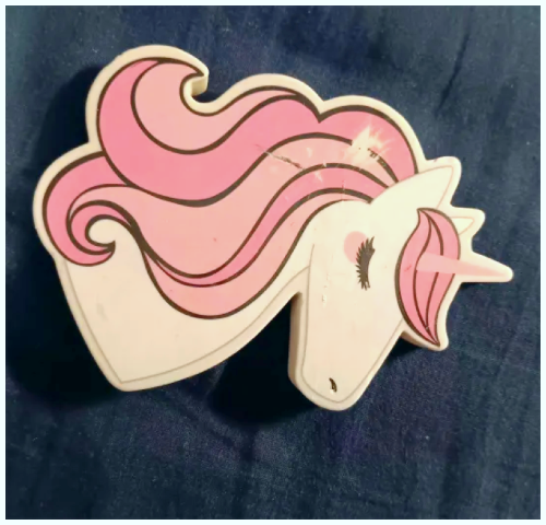 A Unicorn eraser, I wanted to show contrast so I put a dark color behind the eraser.